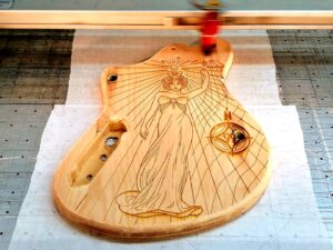 guitar body in machine for customn laser engraving