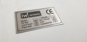 stainless steel machine plate with black text
