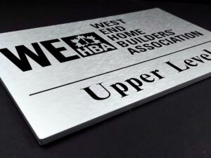 Brushed silver lamacoid sign with black engraving